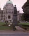 Andrew at a monument to the queen Victoria in city Victoria - capital of the Canadian state British Colombia